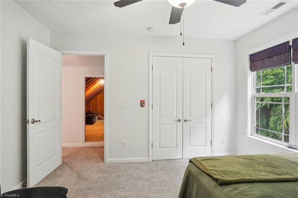 449 Wallburg-High Point Road Winston-Salem, NC 27107 - Photo 32 of 50 Upper level bedroom ~ walk in Attic in the distance