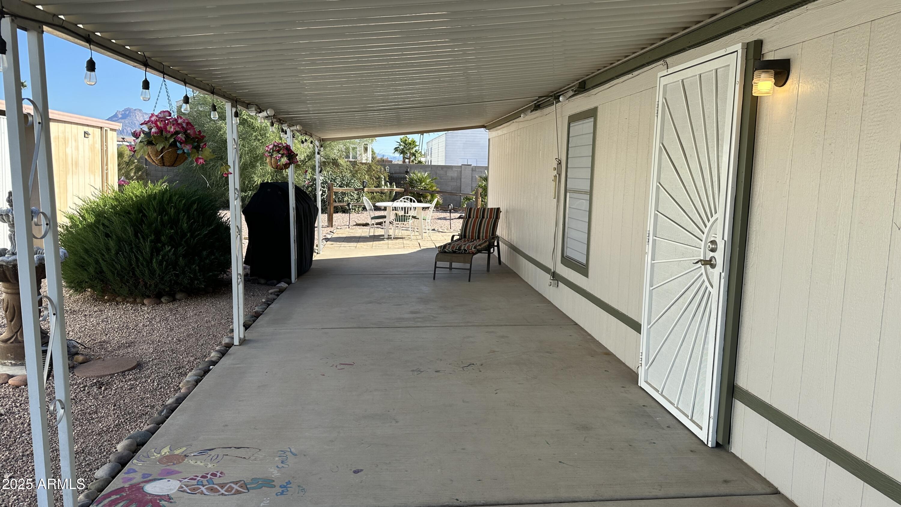 834 South Meridian Road, Unit 105 Apache Junction, AZ 85120 - Photo 33 of 48 a view of room with outdoor seating and stairs