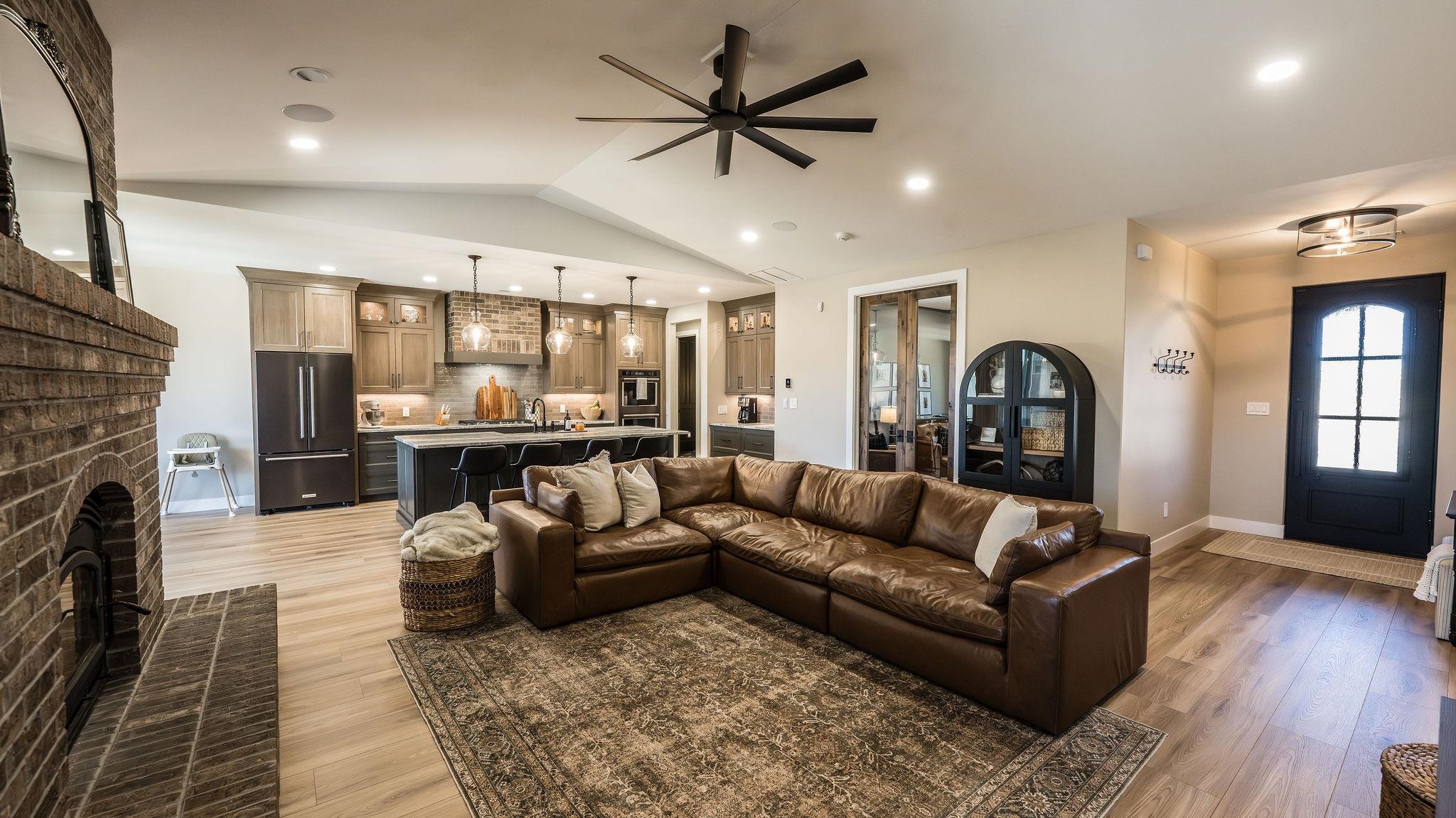 2639 Emerald Ridge Lane Grand Junction, CO 81506 - Photo 4 of 42 a living room with furniture and a fireplace