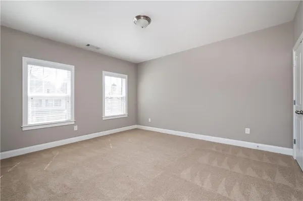 a bathroom with a sink toilet vanity and shower
