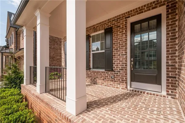 a view of a wooden door with a large window