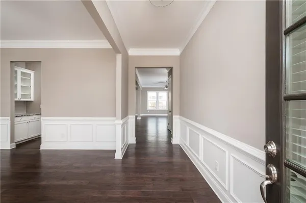 a view of an entryway with wooden floor