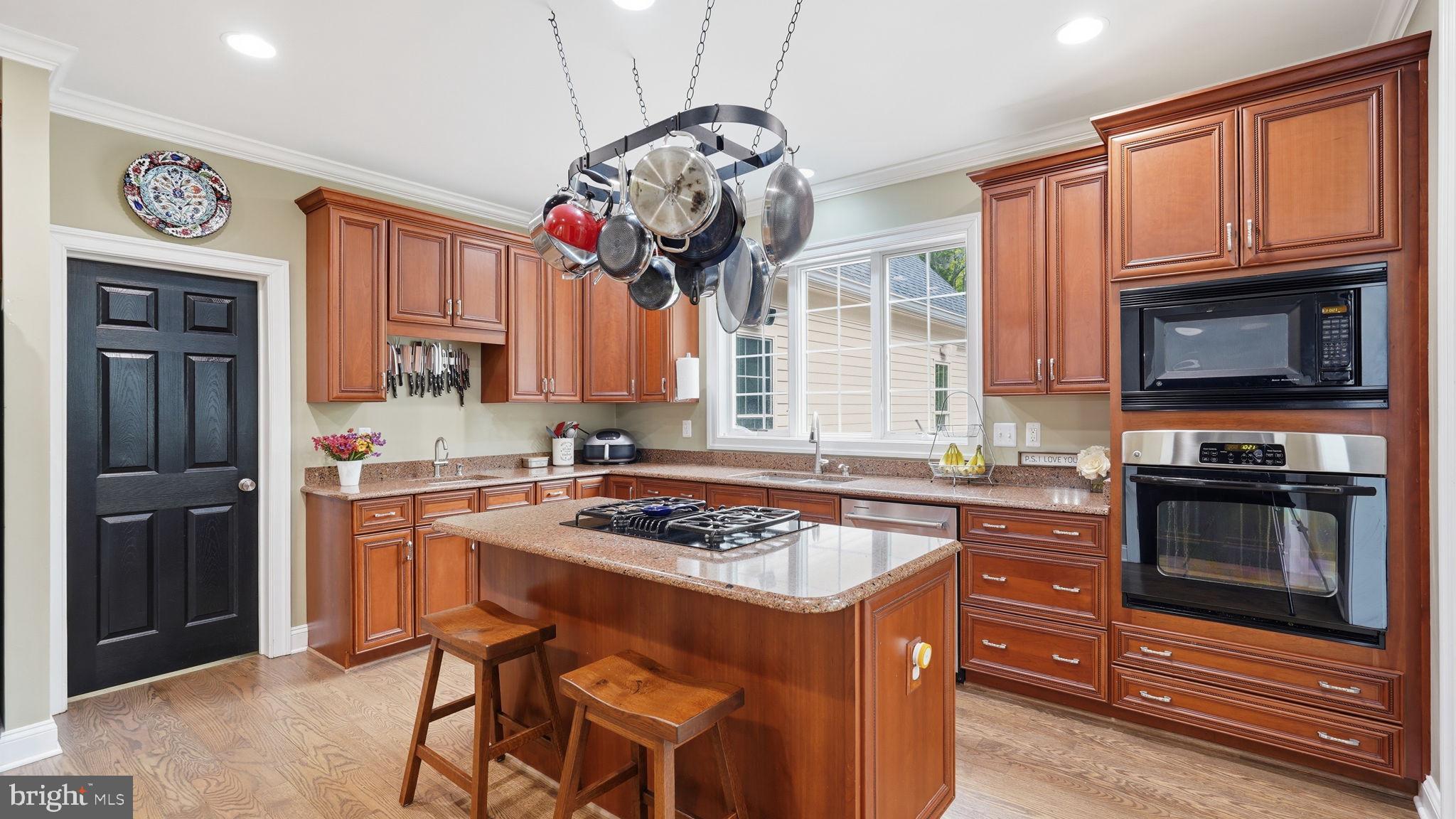 15613 Thoroughfare Road Gainesville, VA 20155 - Photo 12 of 64 Warm, inviting kitchen with rich wood.