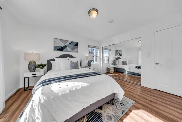 a bedroom with bed and window