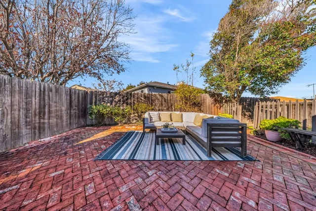 a view of outdoor space with wooden floor