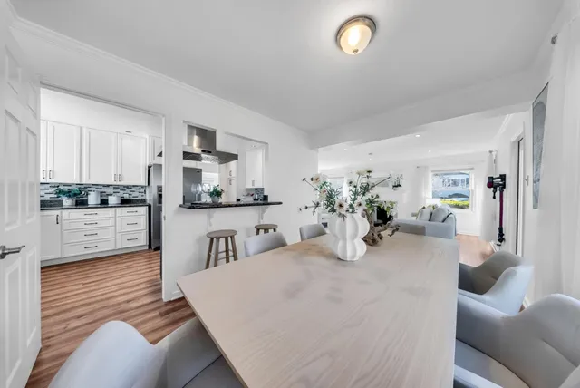 a kitchen with kitchen island stainless steel appliances sink cabinets and counter top space