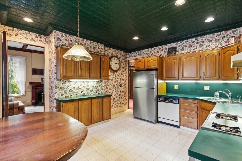 4 Rangeley Road Winchester, MA 01890 - Photo 11 of 42 a kitchen with stainless steel appliances granite countertop a stove and a wooden floors