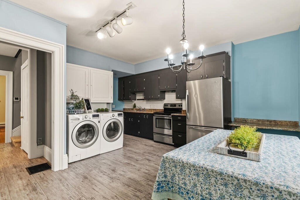 4 Rangeley Road Winchester, MA 01890 - Photo 17 of 42 a kitchen with kitchen island a sink appliances and cabinets