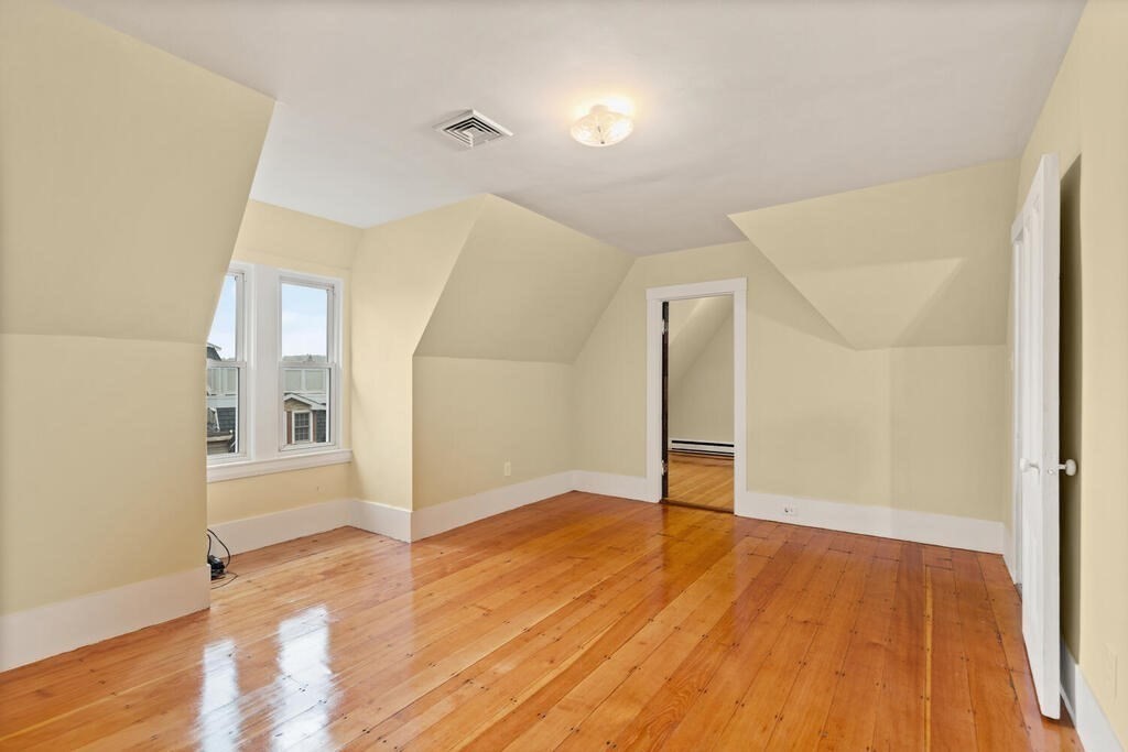 4 Rangeley Road Winchester, MA 01890 - Photo 30 of 42 wooden floor in an empty room with a window