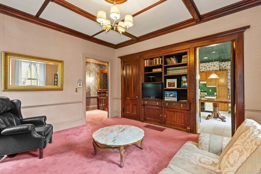 4 Rangeley Road Winchester, MA 01890 - Photo 8 of 42 a living room with furniture a chandelier and a dining table