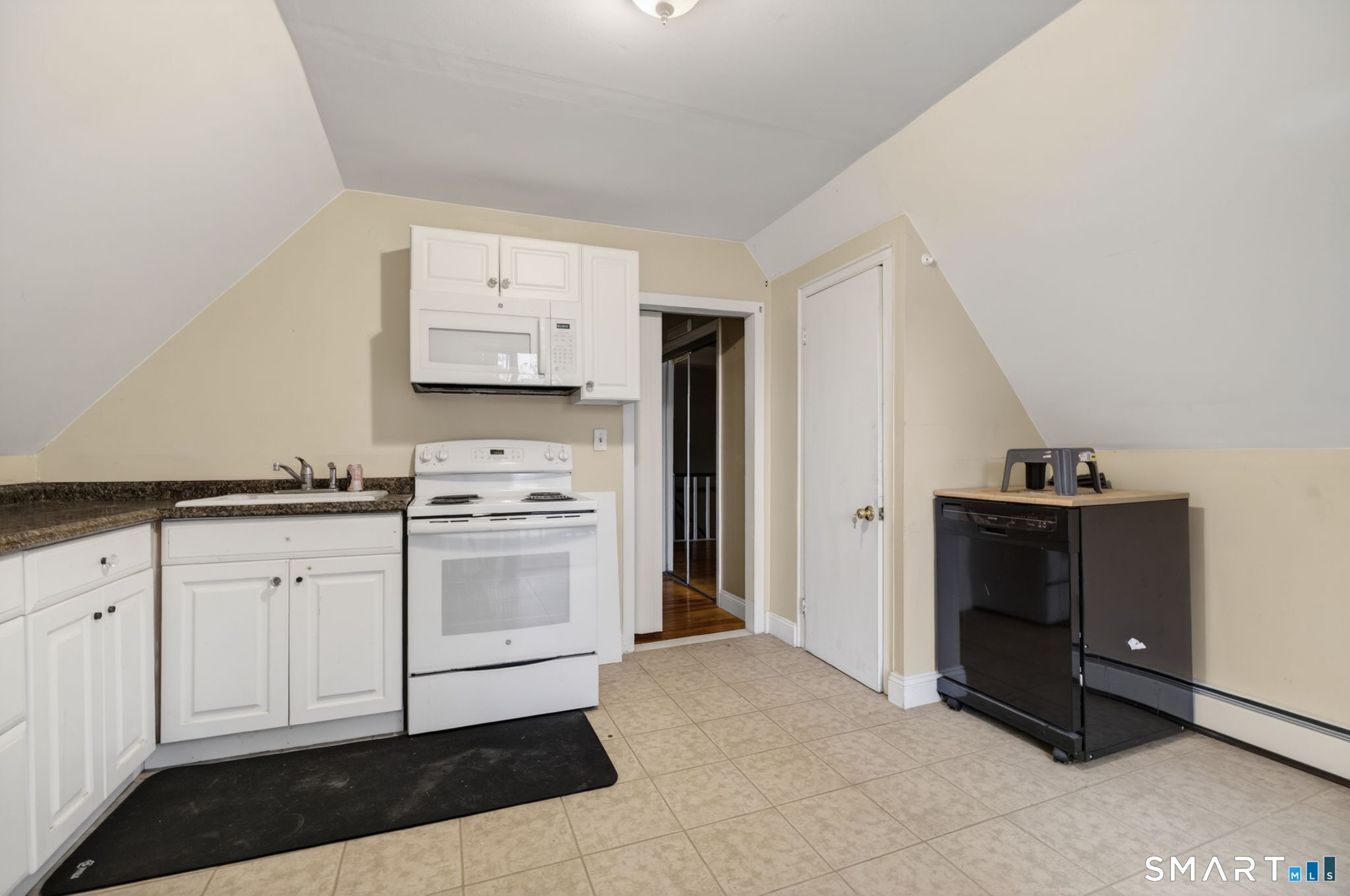 670 Hanover Road Meriden, CT 06451 - Photo 32 of 40 a kitchen with stainless steel appliances white cabinets and a sink