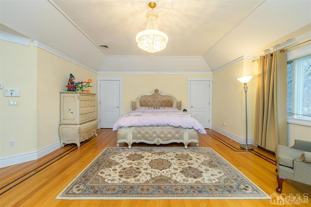 30 Overlook Road Alpine, NJ 07620 - Photo 24 of 36 a bedroom with a bed dresser and a window