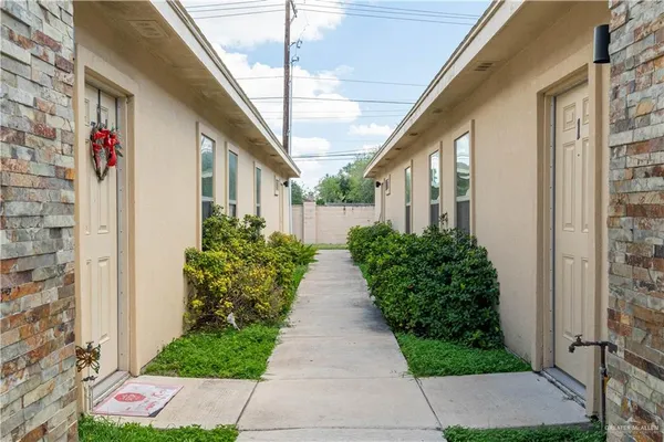 a view of path with flower plants