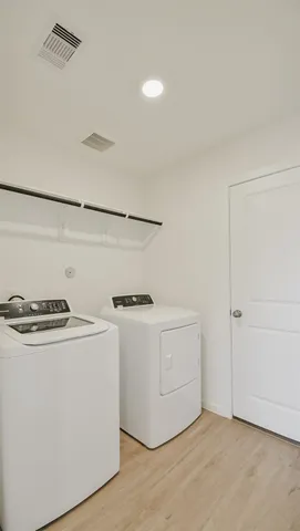 a utility room with washer and dryer