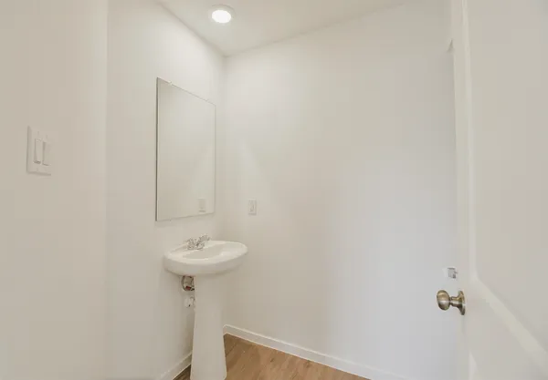 a kitchen with a stove a sink and a refrigerator