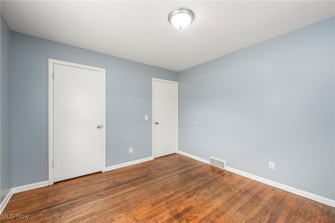 7835 Elyria Road Medina, OH 44256 - Photo 18 of 46 Unfurnished bedroom with baseboards, wood finished floors, and a closet