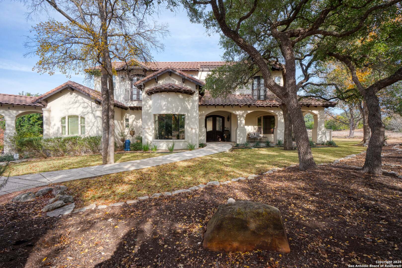 101 River Crossing Boerne, TX 78006 - Photo 15 of 65 a view of house with yard and trees in the background