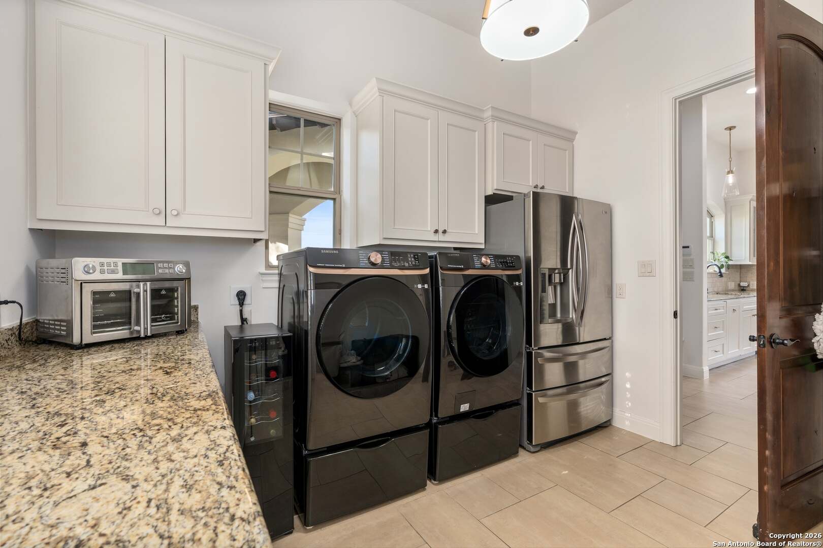 101 River Crossing Boerne, TX 78006 - Photo 39 of 65 a kitchen with stainless steel appliances granite countertop a refrigerator and a stove