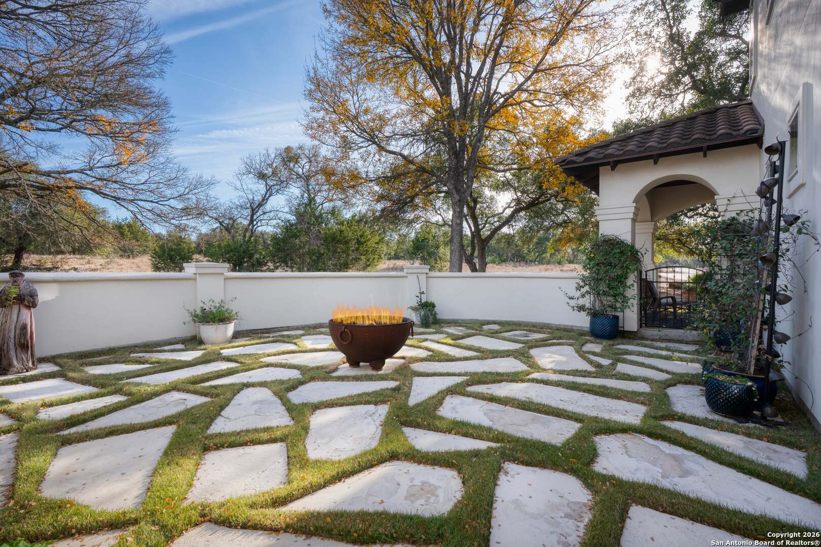 101 River Crossing Boerne, TX 78006 - Photo 51 of 65 a view of a patio with table and chairs under an umbrella