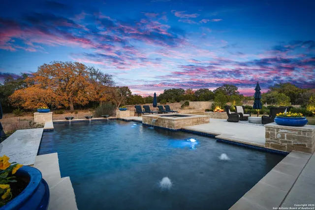 a view of a patio with couches and potted plants
