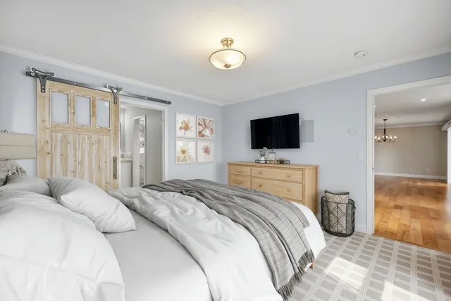 a bedroom with a bed and tv