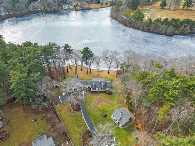 an aerial view of a house with a lake view