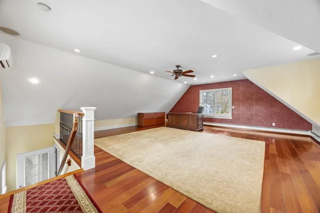 a room with table chairs and wooden floor