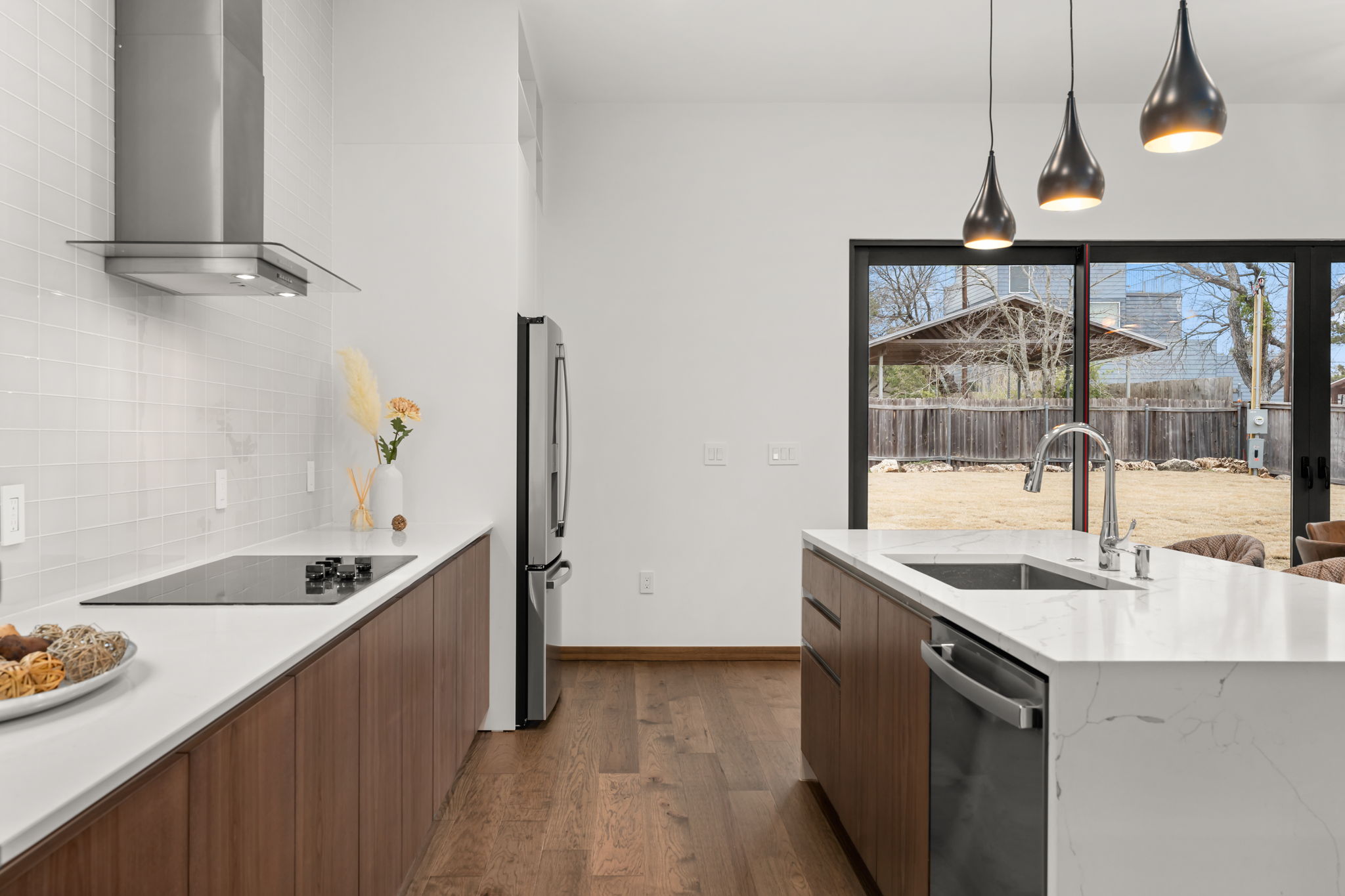 2915 Chisholm Trail Austin, TX 78734 - Photo 11 of 35 a kitchen with sink refrigerator and window