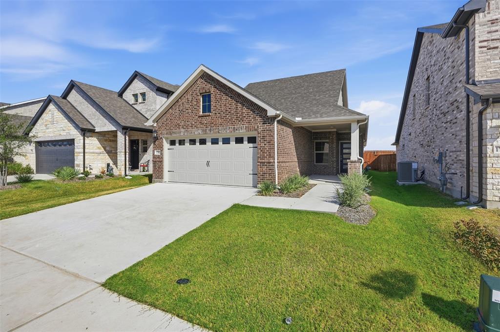 1701 Arches Road Anna, TX 75409 - Photo 1 of 19 Brick and stone exterior with a covered porch