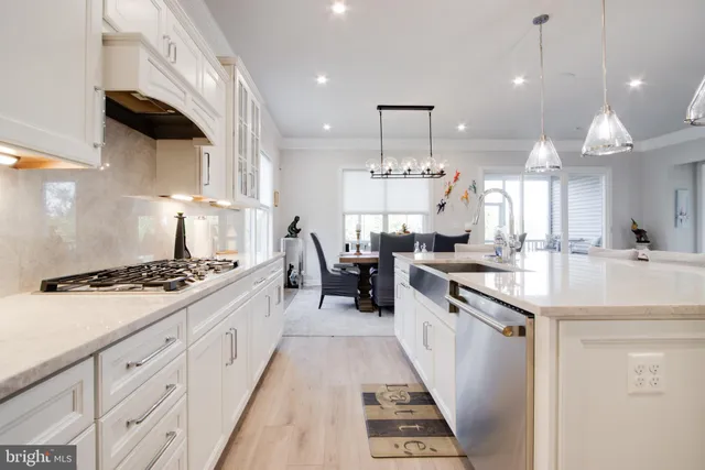 a dining room with furniture and wooden floor