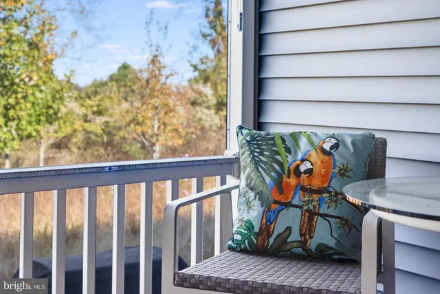 a living room with furniture and a book shelf