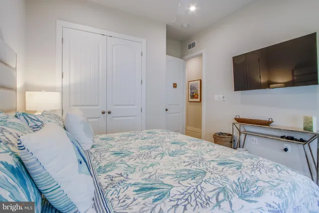 a living room with fireplace furniture and a flat screen tv