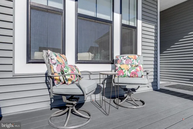 a living room with furniture workspace and a flat screen tv