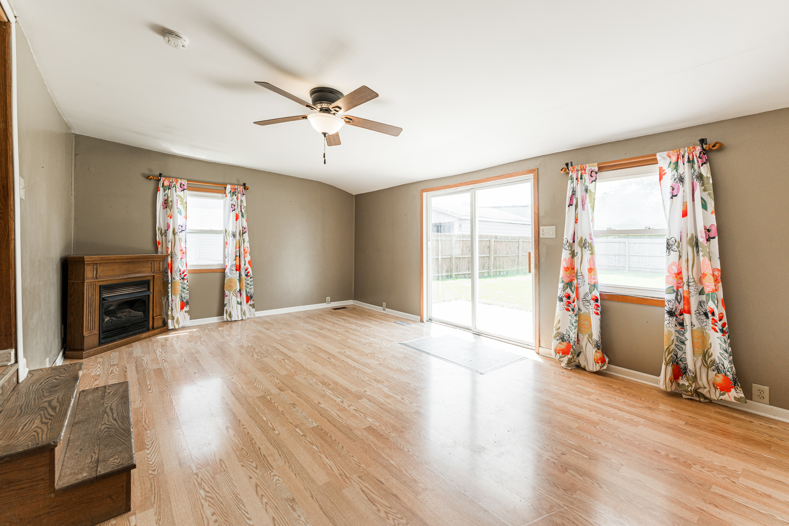 344 Grant Street Sycamore, IL 60178 - Photo 12 of 29 a view of an empty room with a window and wooden floor