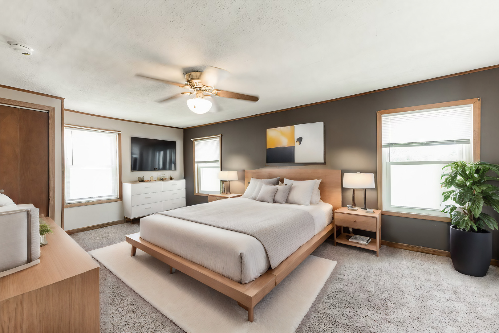 344 Grant Street Sycamore, IL 60178 - Photo 16 of 29 a bedroom with a large bed and a chandelier