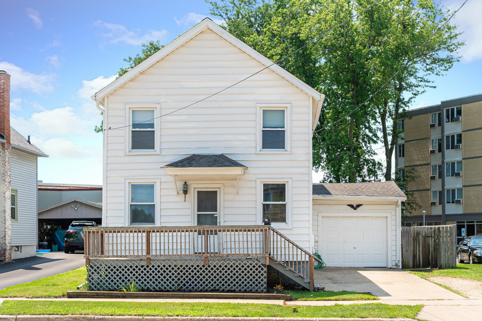 344 Grant Street Sycamore, IL 60178 - Photo 29 of 29 a view of a white house with a white door