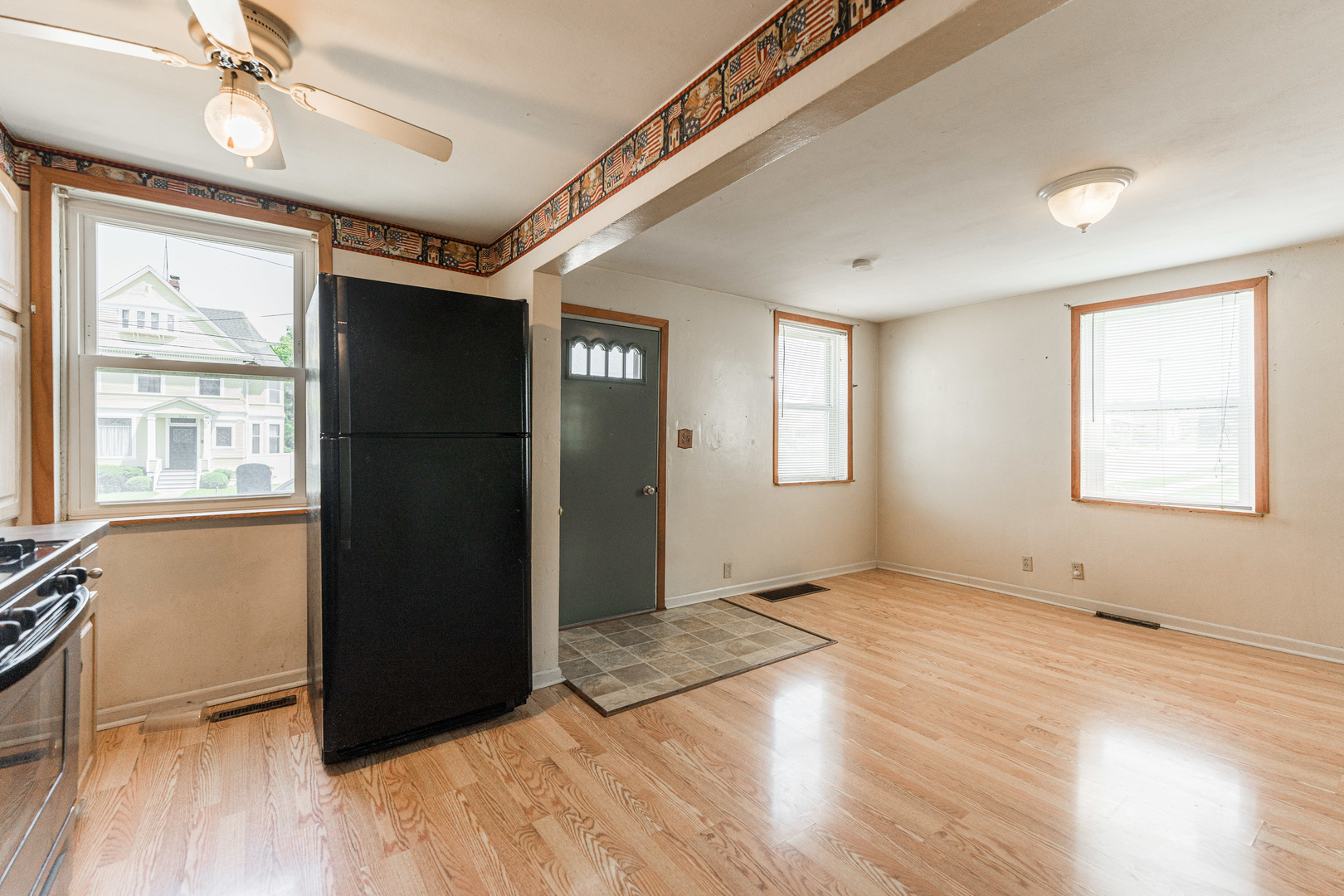 344 Grant Street Sycamore, IL 60178 - Photo 8 of 29 an empty room with wooden floor and windows