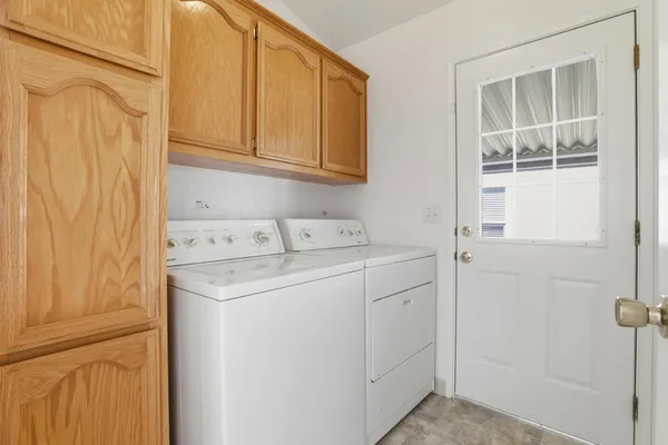 a utility room with dryer and washer