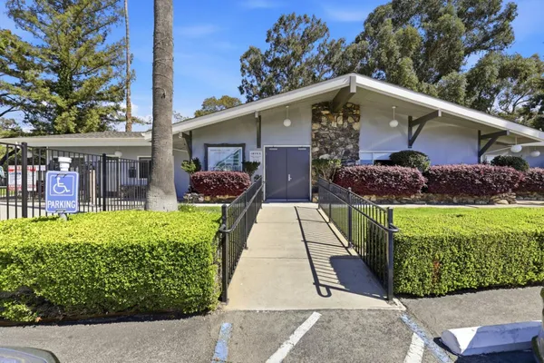 a group of people sitting in a living room
