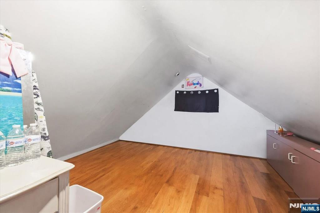 409 Tryon Avenue Englewood, NJ 07631 - Photo 21 of 33 a living room with a bed