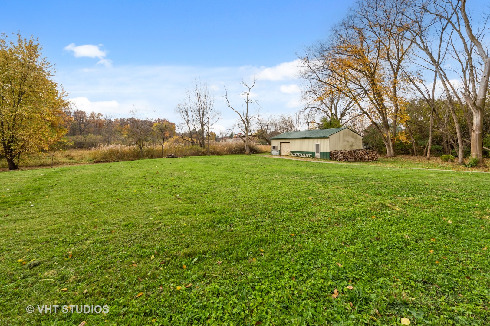18607 McGuire Road Harvard, IL 60033 - Photo 4 of 14 a view of a field of grass and trees