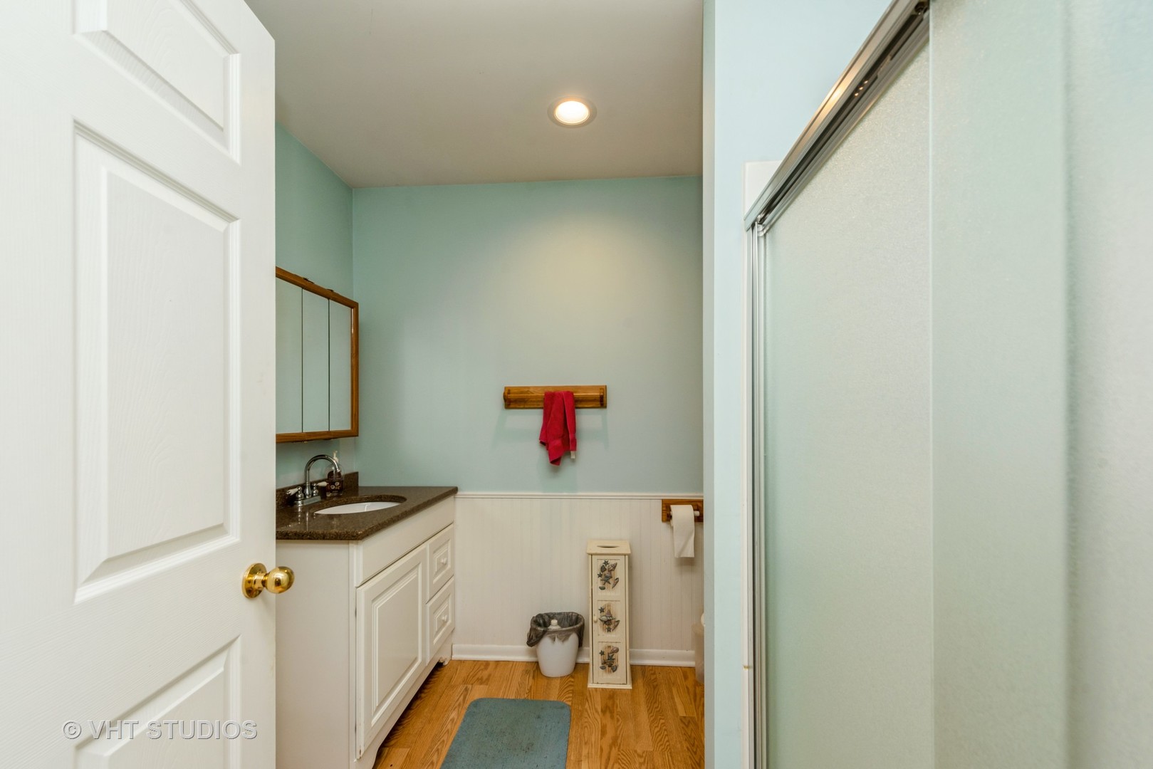 18607 McGuire Road Harvard, IL 60033 - Photo 9 of 14 a bathroom with a sink a mirror and shower