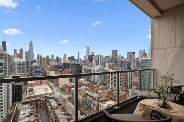 a view of a balcony with city