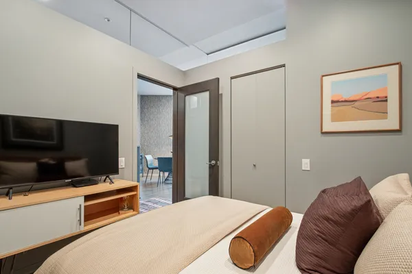 a room with a bed and a television in it