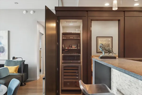 a en suite bathroom with a granite countertop sink and a mirror