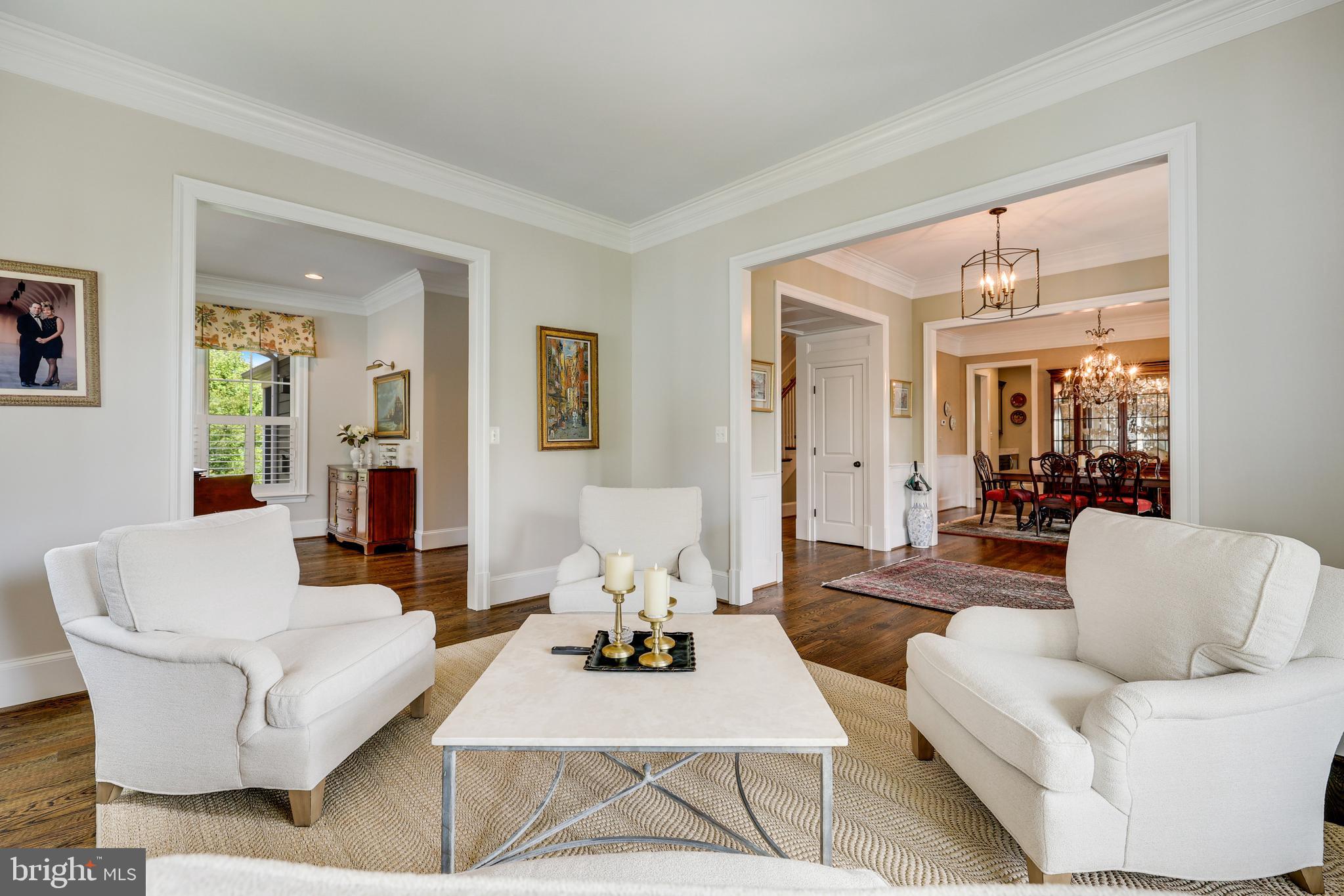 1415 Kurtz Road McLean, VA 22101 - Photo 11 of 129 a living room with furniture and a large mirror next to a window