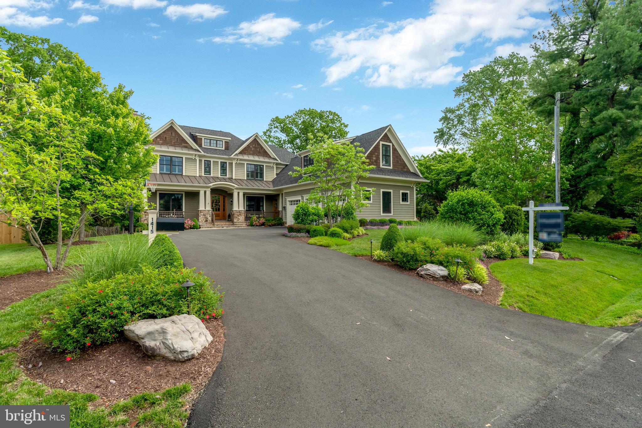 1415 Kurtz Road McLean, VA 22101 - Photo 118 of 129 a front view of a house with a yard and potted plants