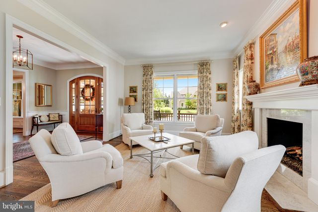 a living room with fireplace furniture and a flat screen tv