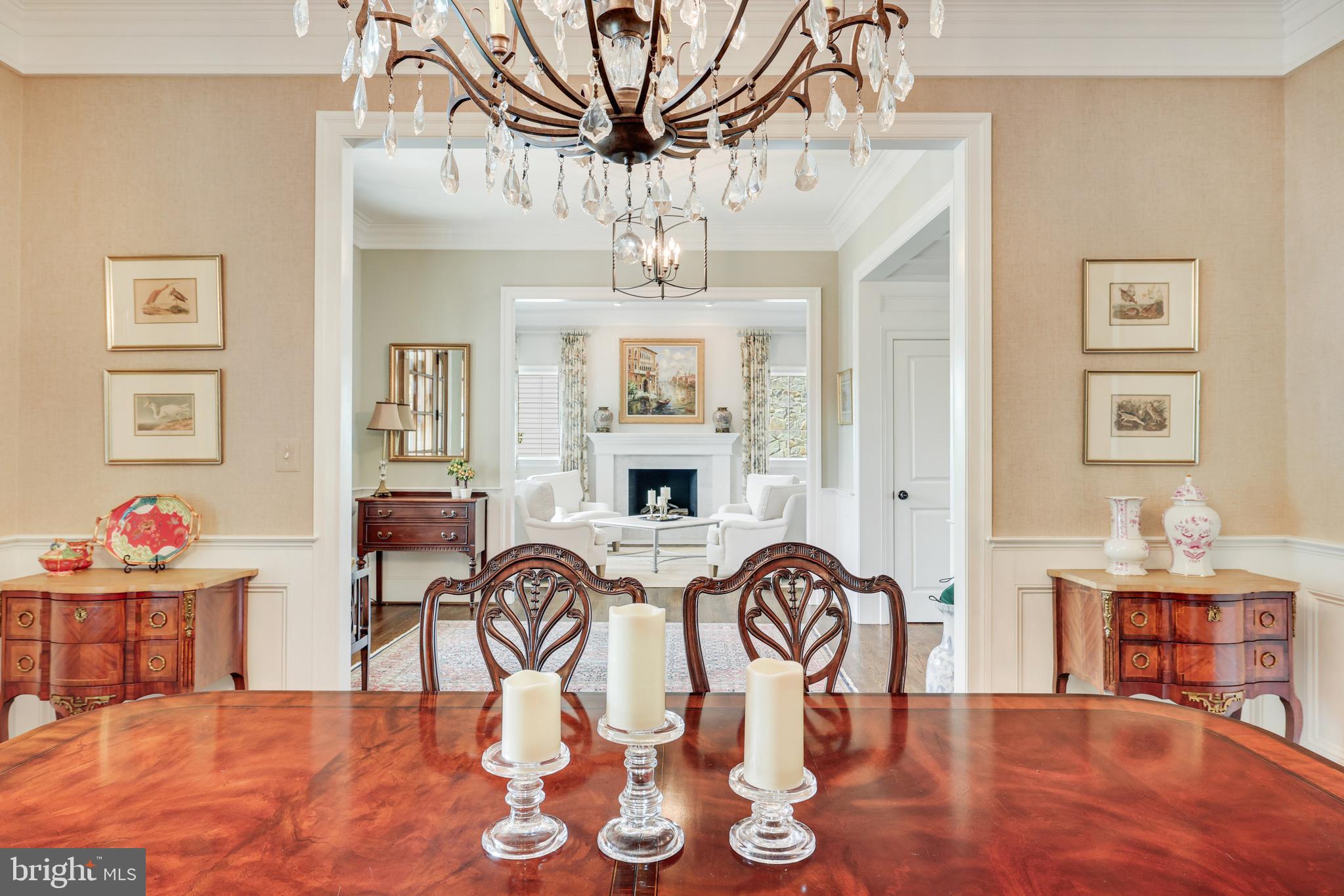 1415 Kurtz Road McLean, VA 22101 - Photo 19 of 129 a view of a dining room with furniture a chandelier and wooden floor
