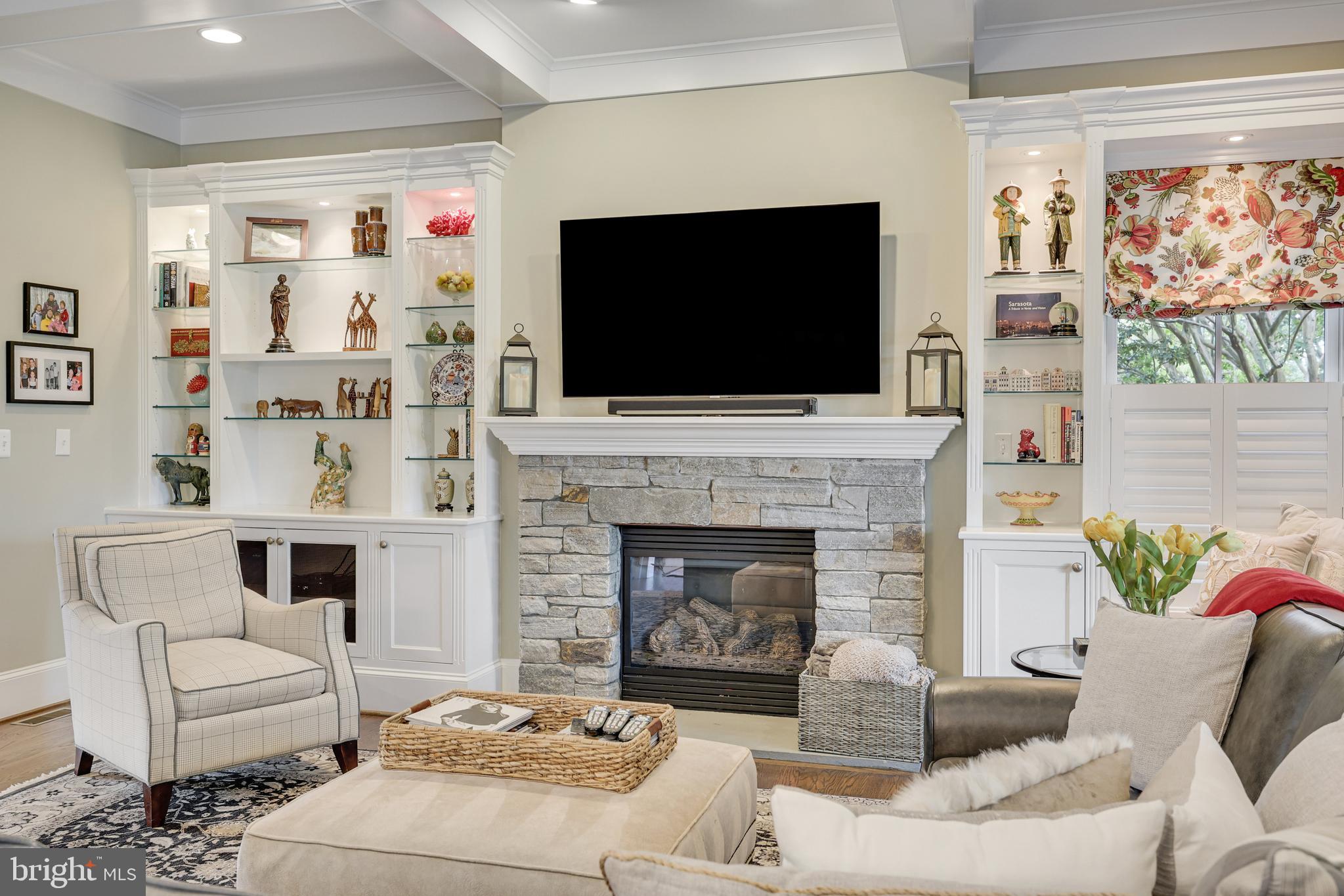 1415 Kurtz Road McLean, VA 22101 - Photo 25 of 129 a living room with furniture a flat screen tv and a fireplace